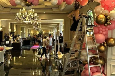 SRQ Women's Expo team creating the grand entrance at the Ritz-Carlton